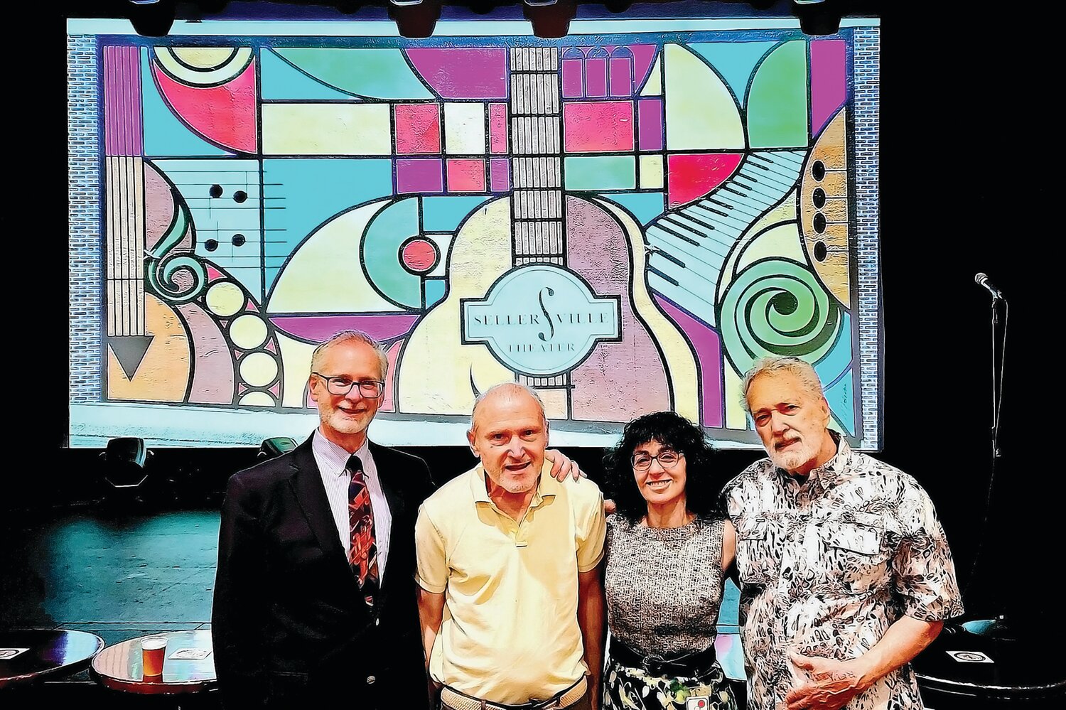 Stephen Barth, of Barth Consulting Group, William Quigley and Elayne Brick, Proprietors of the Washington House and Sellersville Theater stand  with mural designer Domenic Falcone.