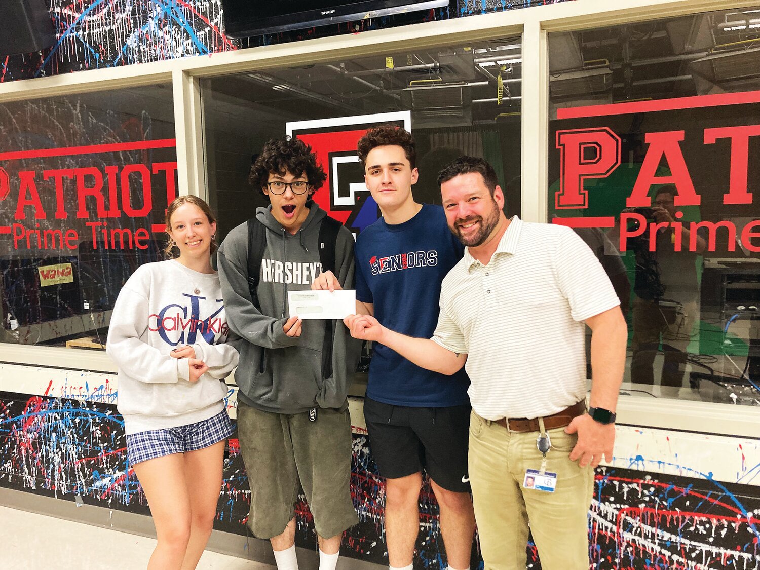 On behalf of the technology education department, students from Central Bucks High School East accept a $500 cash grant for winning this year’s Teen Driver Safety Video PSA Challenge powered by Comcast.