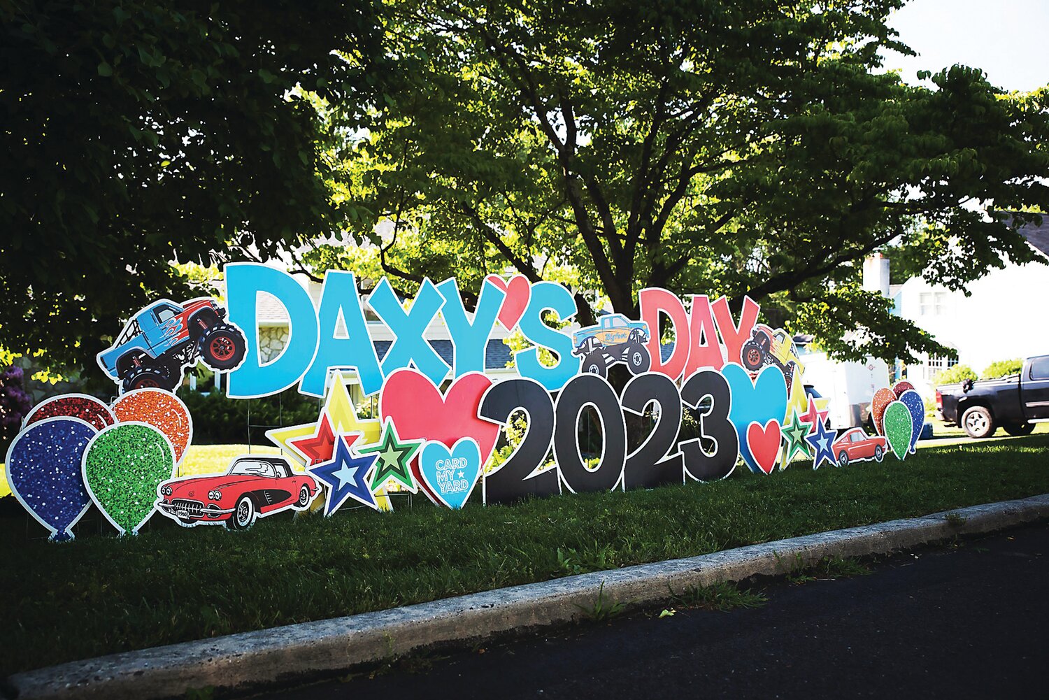 A sign welcomes the Babcocks’ friends, relatives and neighbors to Daxy’s Day 2023, a May 27 block party on their Lower Southampton street.