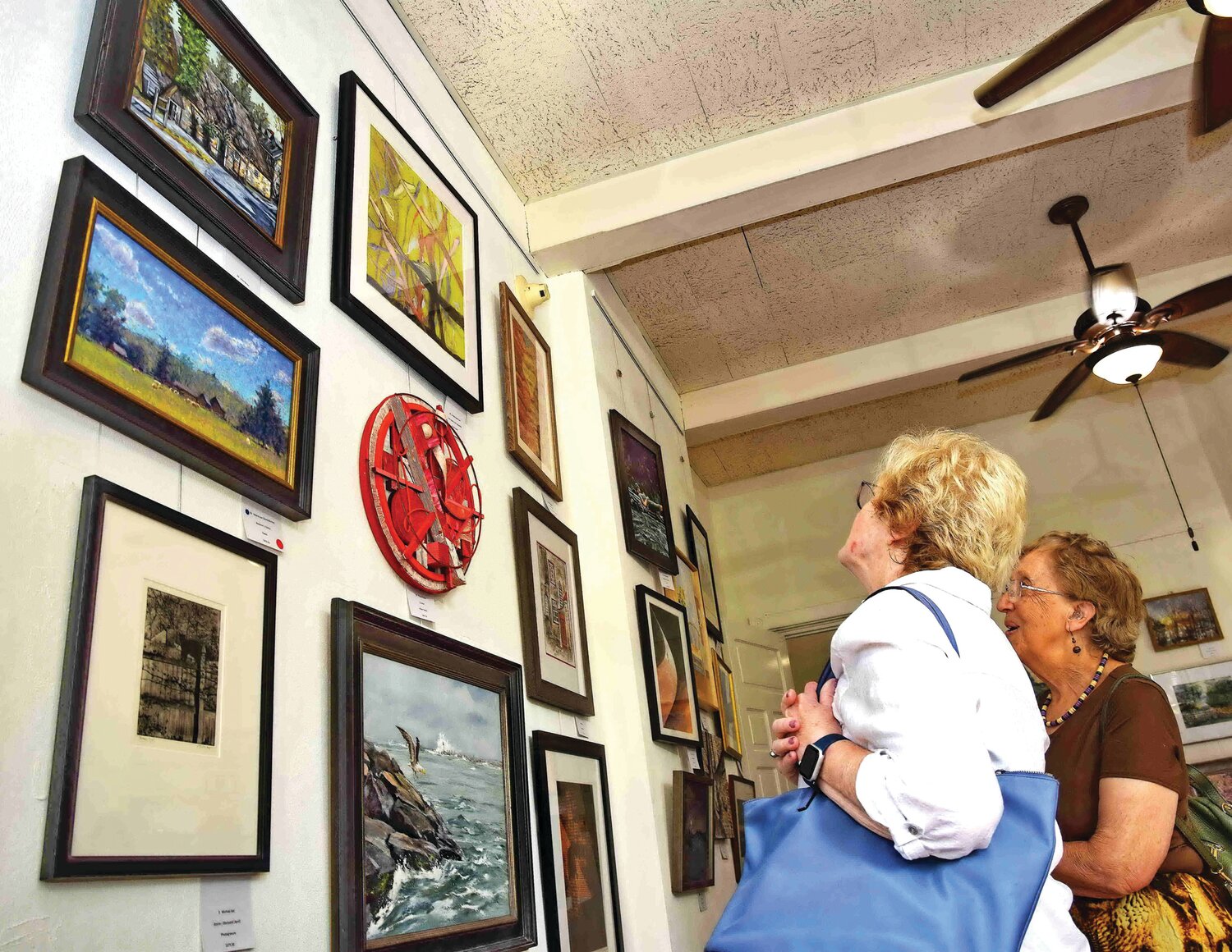 Visitors admire works of art featured in the “R.E.D. Show.”