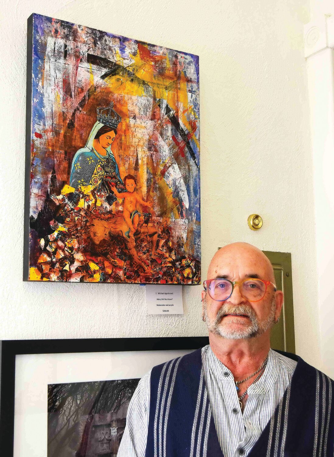 Michael Agenbroad stands next to his collage, watercolor and acrylic work of art, “Mary Did You Know?”