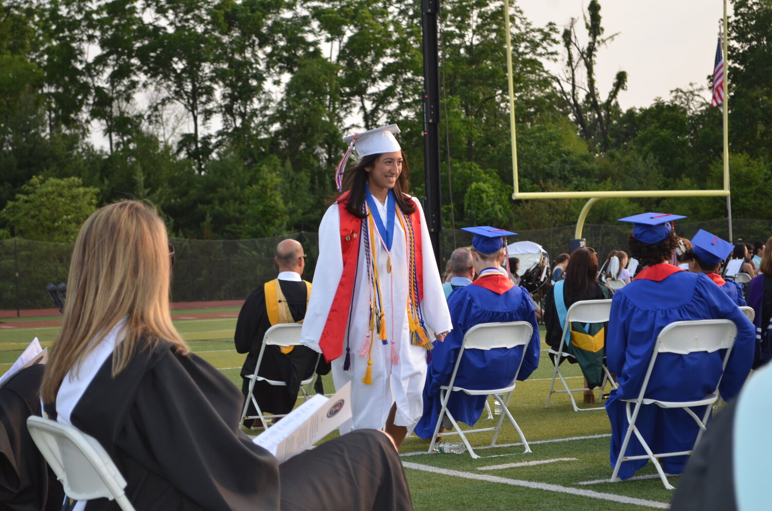 Central Bucks High School East graduate Tooba Khan returns to her seat after a performance during the school’s commencement ceremony.
