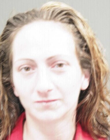 Kathryn Stewart, 31, was arrested  on outstanding warrants Monday during a manhunt for an associate of hers, Beau Booth, 41.
