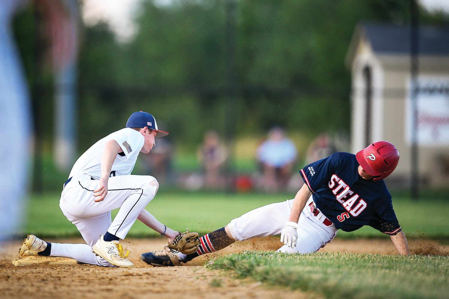 Doylestown shortstop Will Hogenhauer tags out Plumstead’s Nate Wiseman while attempting to steal second during the fifth inning.
