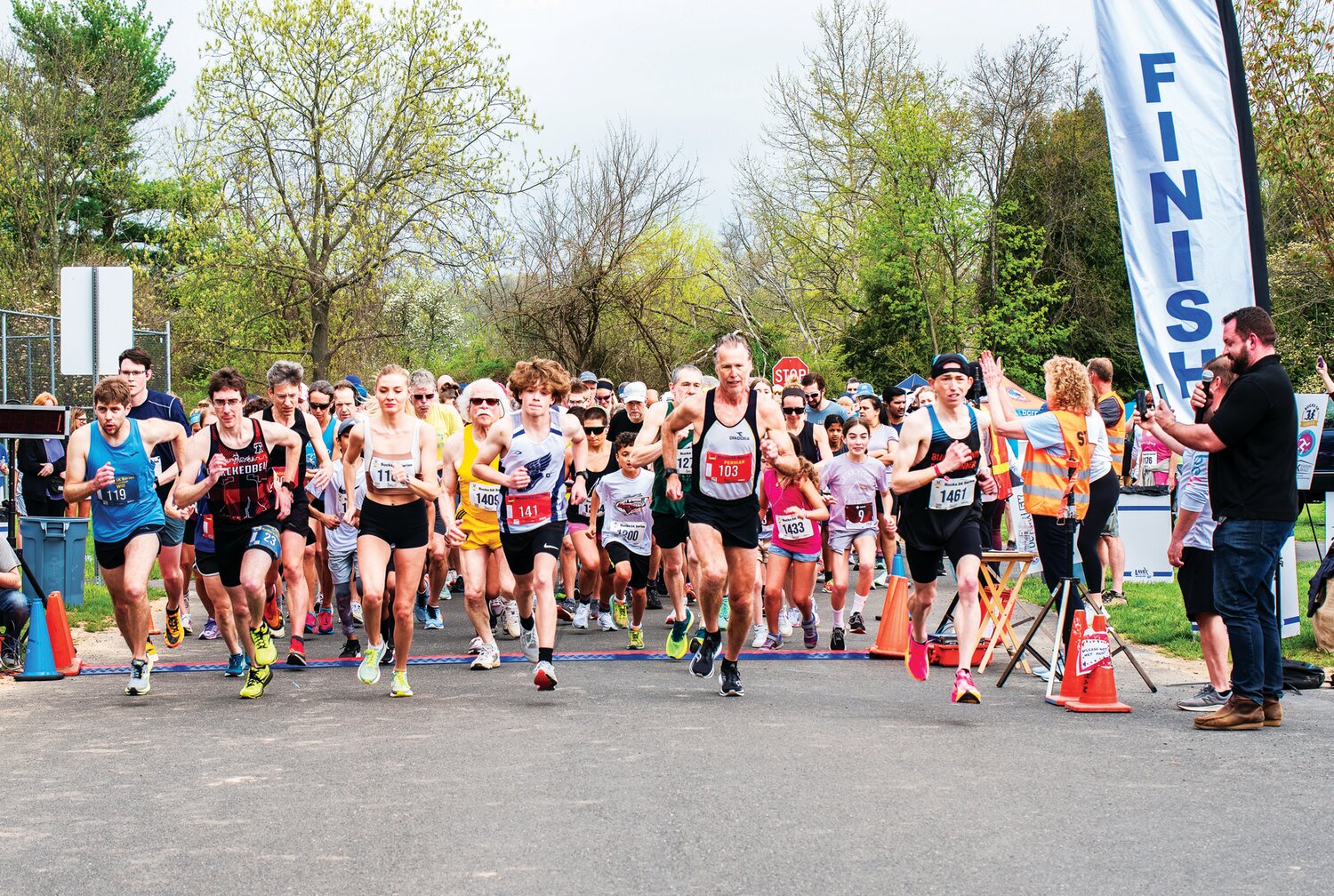 Runners leave the starting line at the Be Kind 5K on April 15 in Holicong Park.