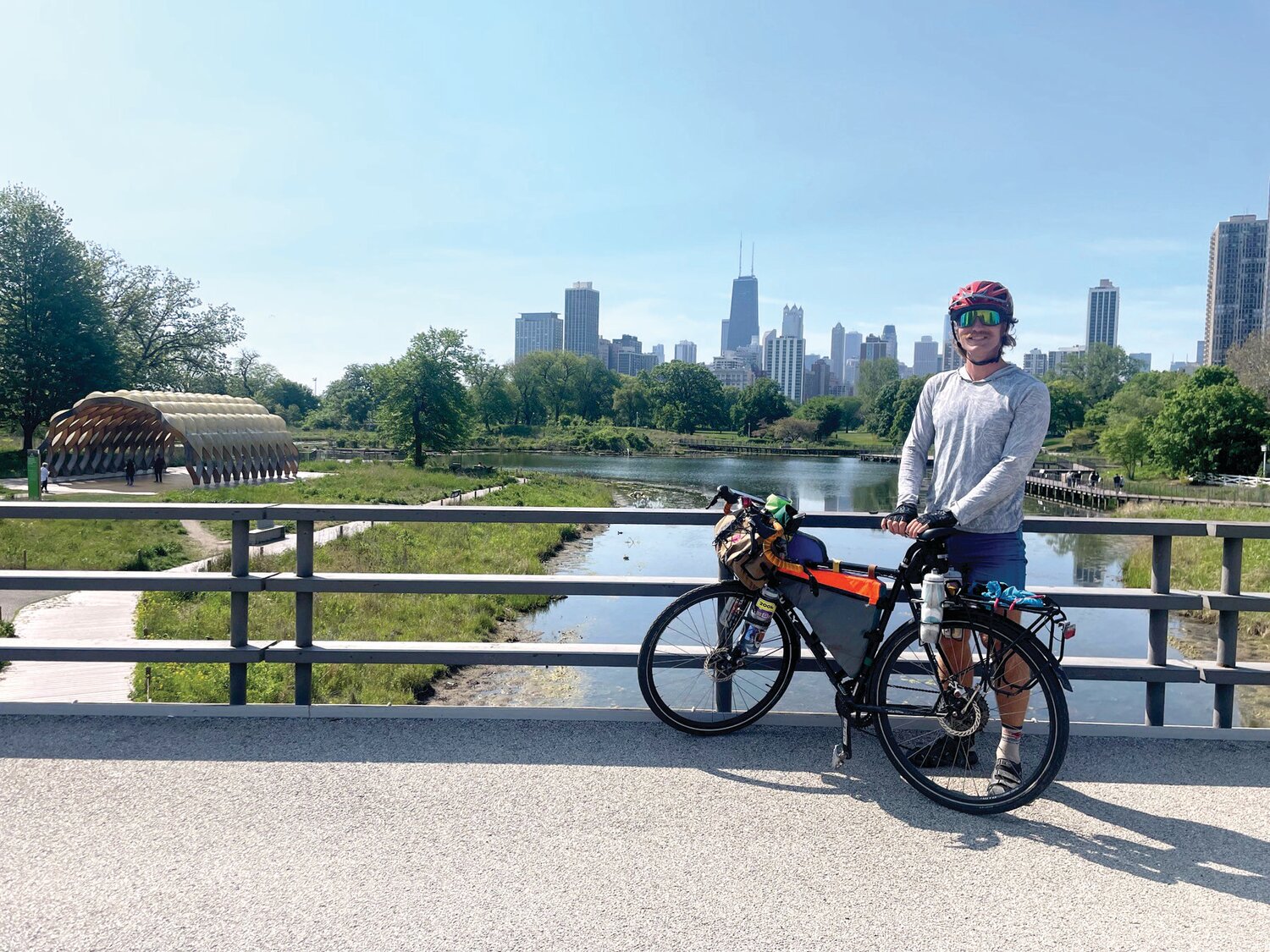 Yardley native Spencer McCullough, framed by the Chicago skyline, is on a bicycling journey to all 51 national parks in the lower 48 states.