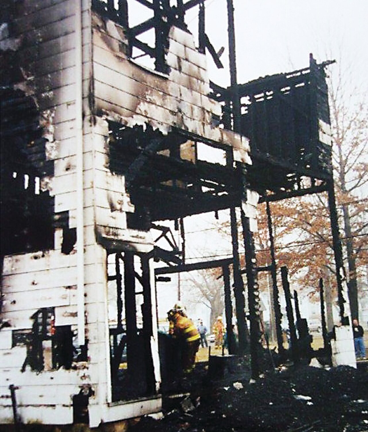 Crews work at the ruins of Ivyland Borough Hall as onlookers take in the scene of the charred structure in January 1998.