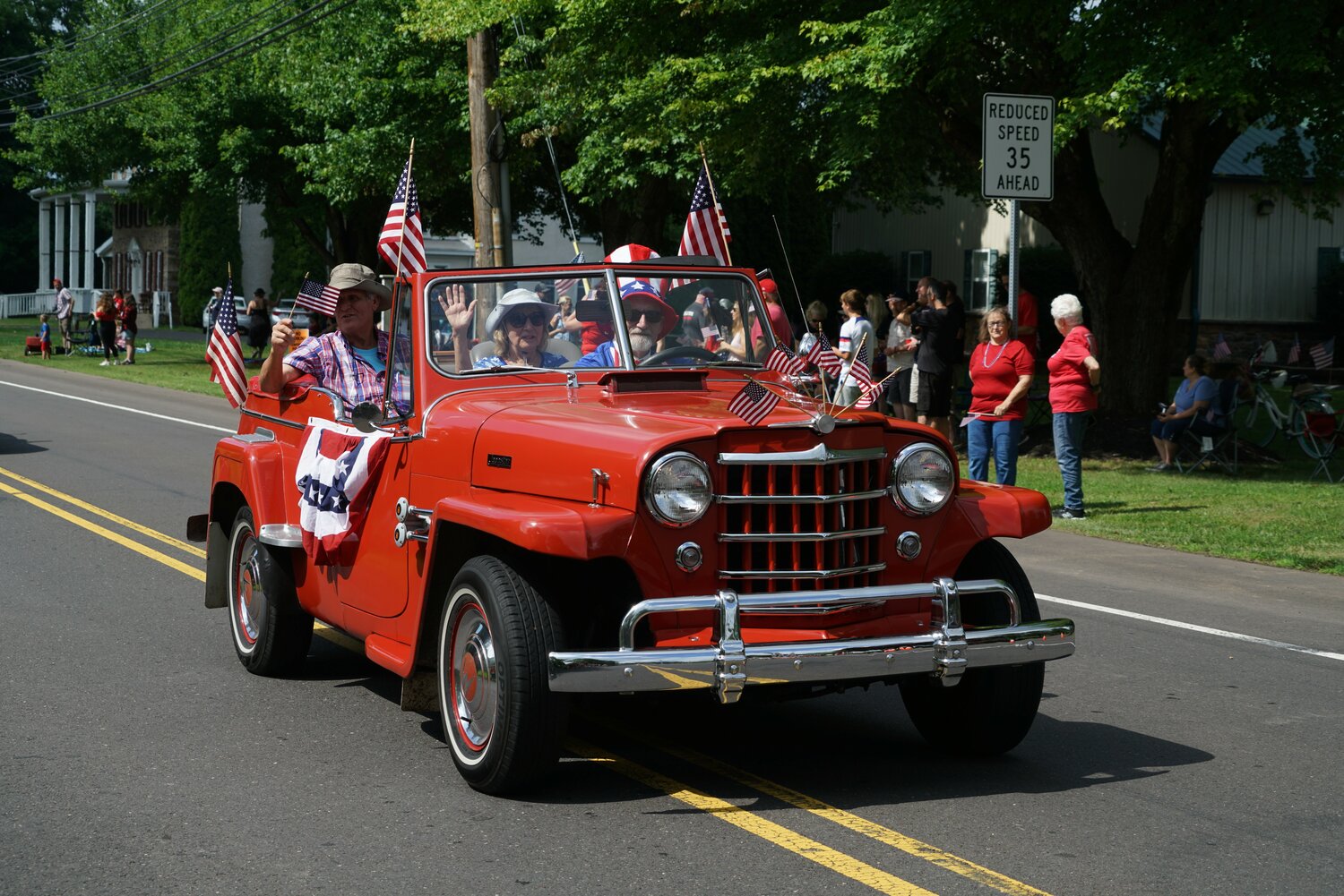 A classic Jeepster rolls along the Tri-Municipal July 4 Parade route.
