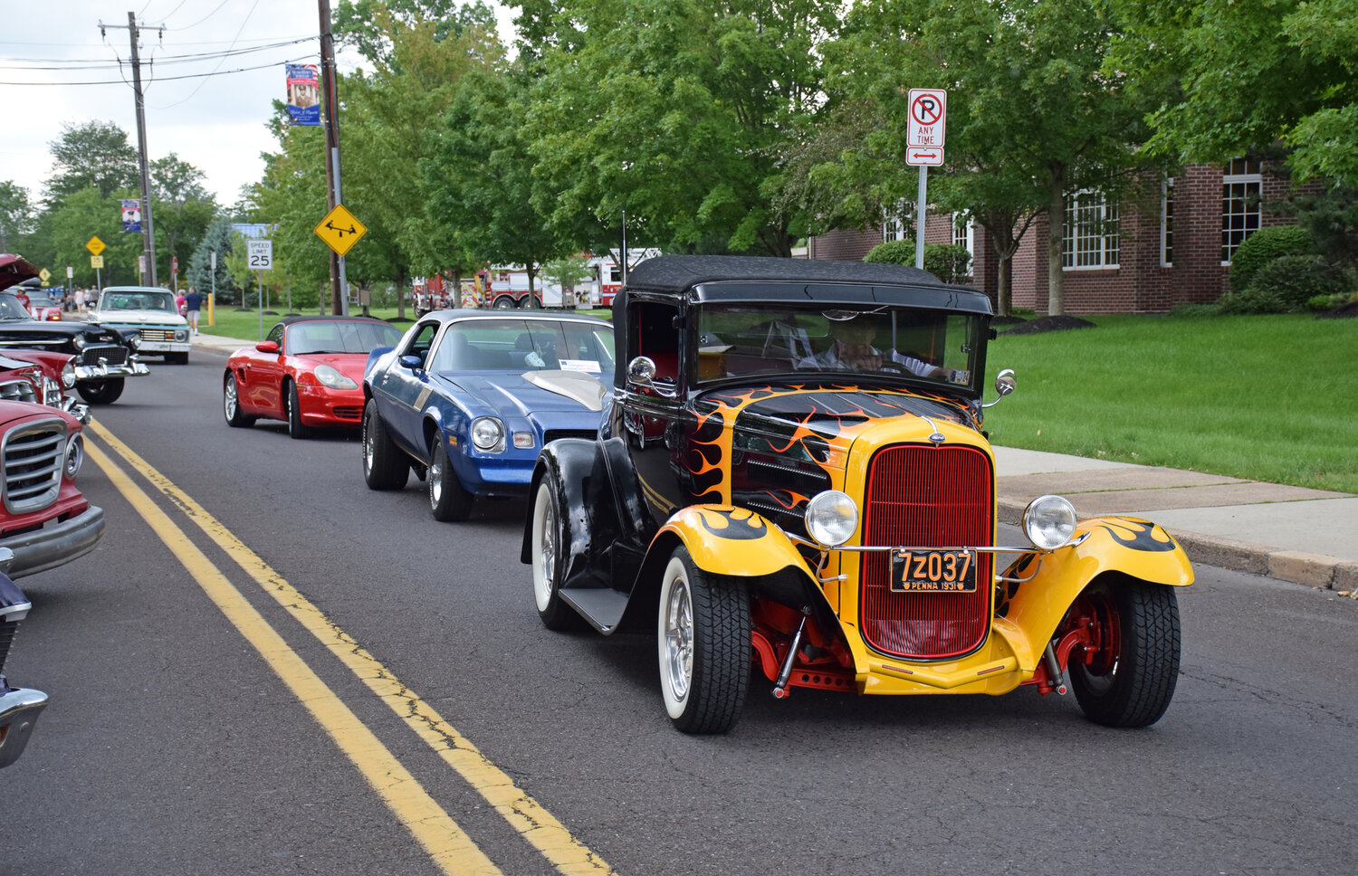 Vehicles roll out from the Quakertown Community Day 2023 Car Show.
