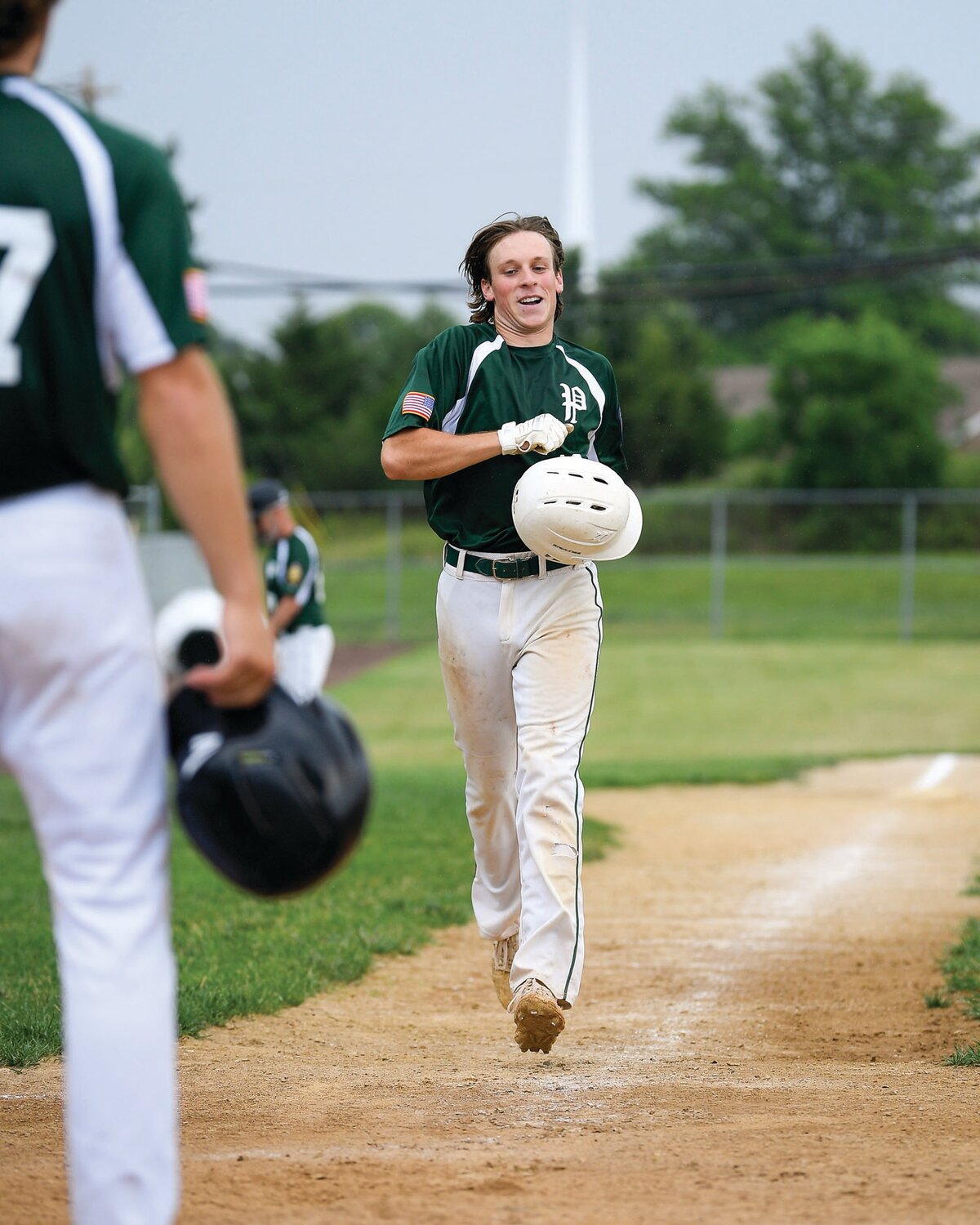 Pennridge’s Robbie Pliszka is greeted at home plate after hitting a grand slam in the fourth inning of Game 1 of a doubleheader with Nor-Gwyn.