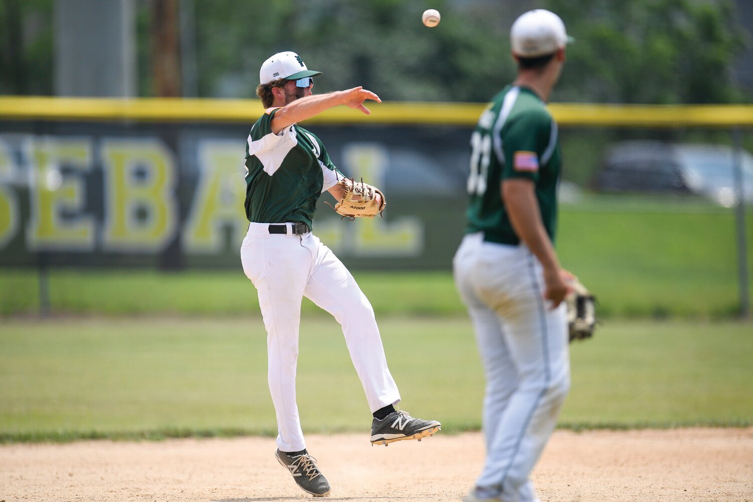 Pennridge’s Nate Lapp fields a grounder as Ryan Hass, third baseman, watches during the first inning of Sunday’s Game 1 doubleheader.