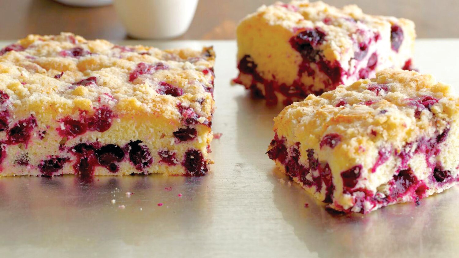 Lots of fresh blueberries now in season add flavor and nutrition to this blueberry buckle, a simple American dessert.