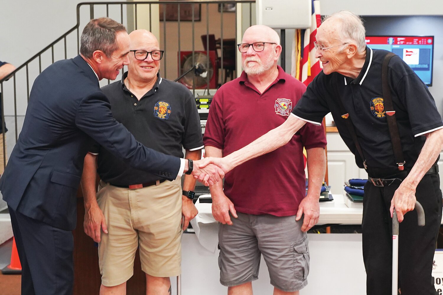 State Sen. Steve Santarsiero, D-10, shakes the hand of Clayton Long, a life member of Doylestown Fire Co. #1, on June 7.