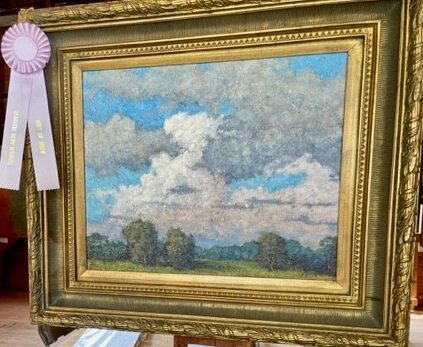 Best of Show art competition winner, David Hahn’s “Summer Clouds” is adorned with a ribbon marking the acrylic painting the top piece at this year’s Tinicum Arts Festival.