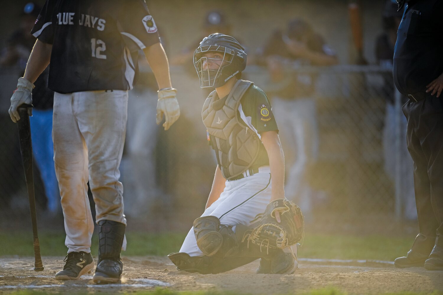 Pennridge catcher Joe Santora during the first inning’s fading sunlight, before storms stopped the game in the third inning for 30 minutes.