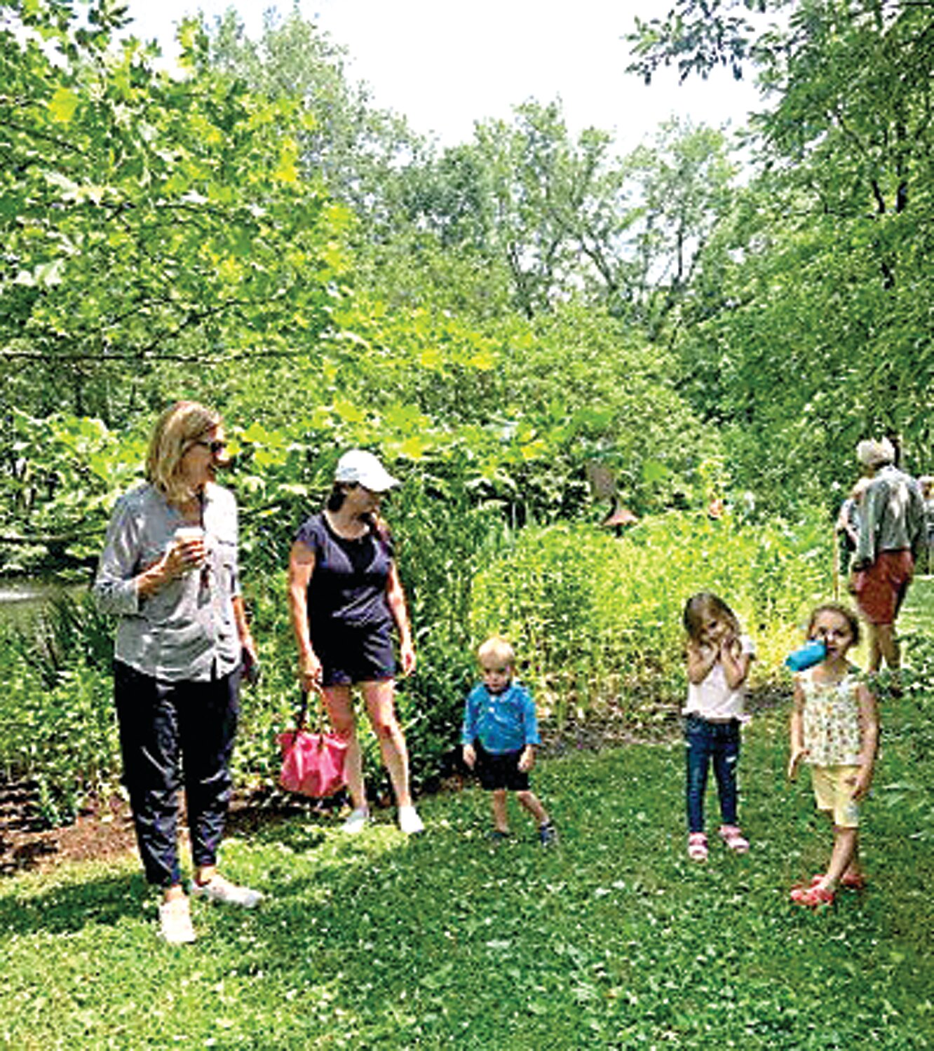 Sadie Clency, Maddie Borski and Aiden Clancy and kids tour the the Delone-Kennedy garden.