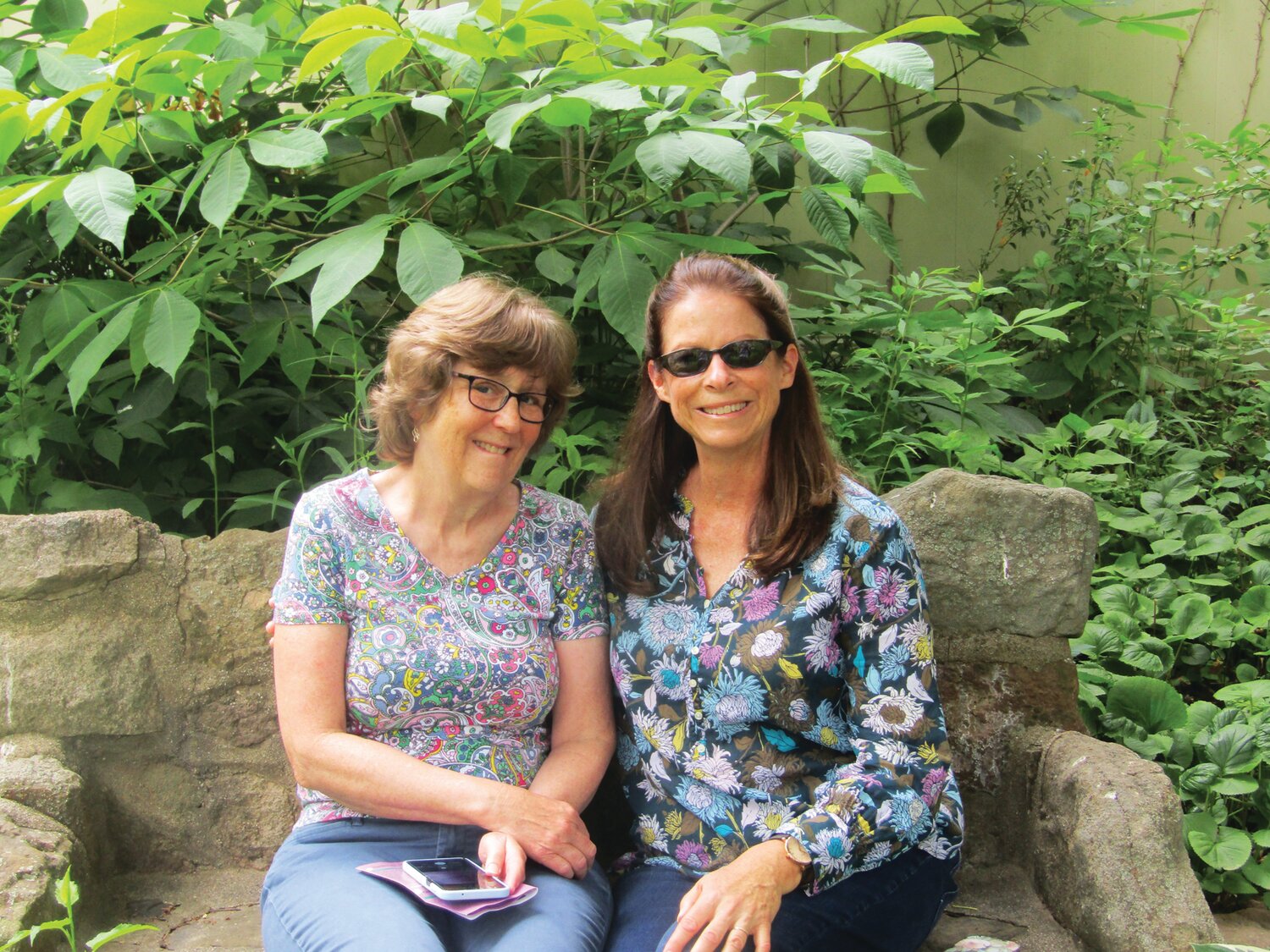 Cindy Nuss and Heidi Shiver in the Winters garden.