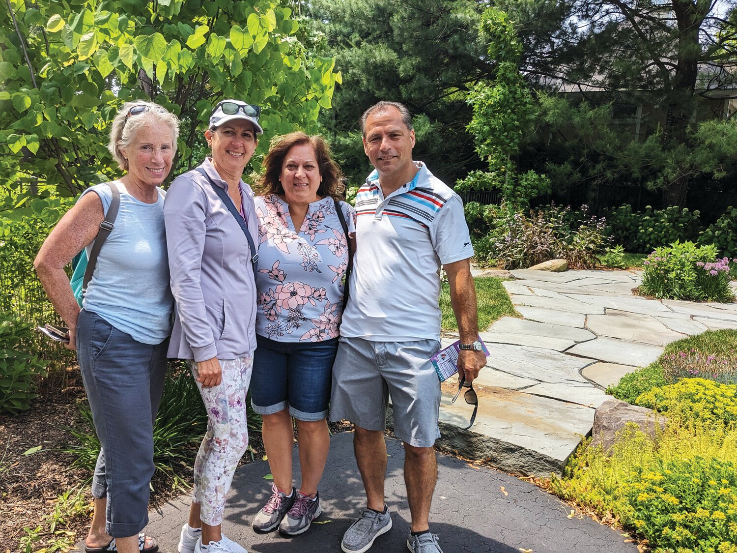 Dawn Cliver, Cindy Gulian, Jenny and Chris Firestone in the Goodyear-Morgan garden.