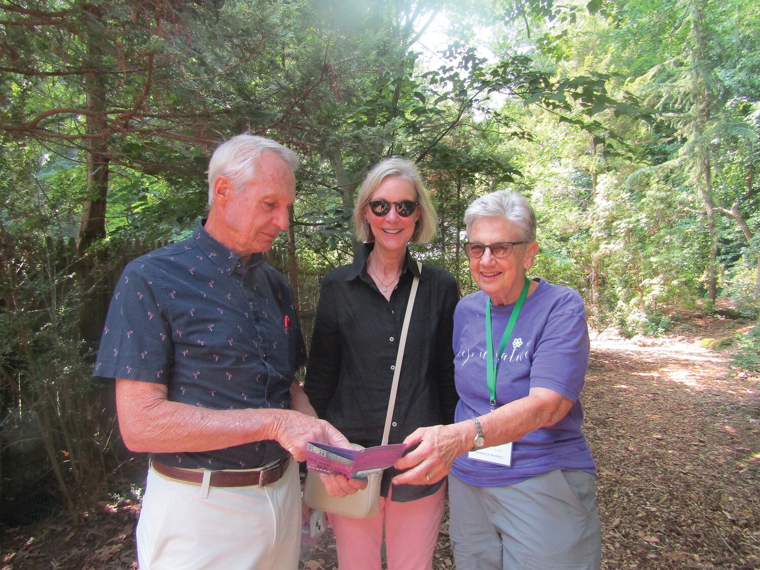 Kathryn Leonard, Robert Elliott and Jean Barrell in the Buckwalter garden.
