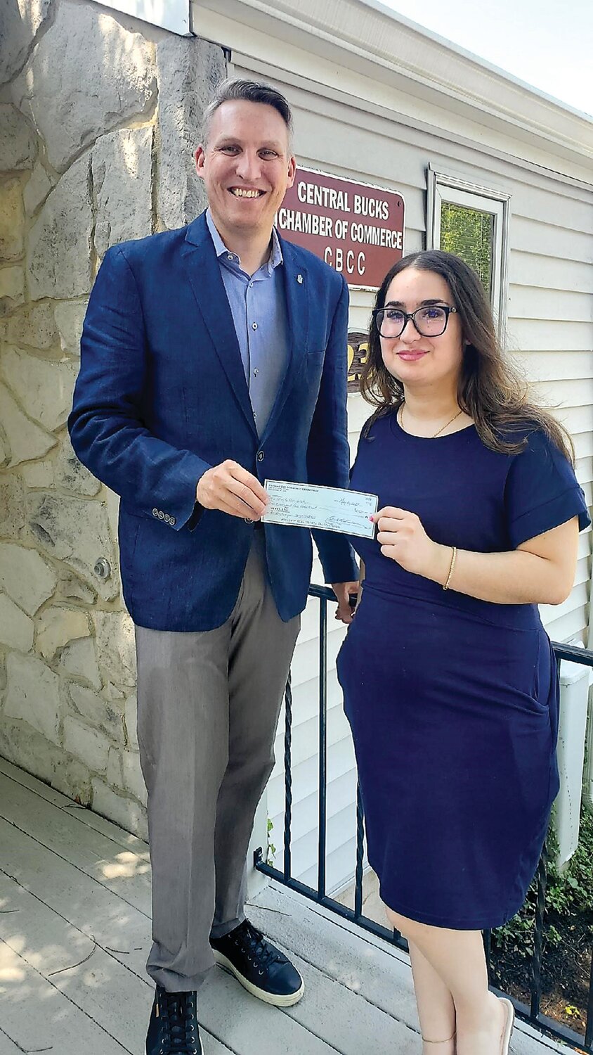 Foundations Community Partnership Executive Director Dr. Tobi Bruhn, left, awards Temple University student Ani Zeytunyan a $2,500 check as part of the Central Bucks Chamber of Commerce’s Women in Business Scholarship Program.