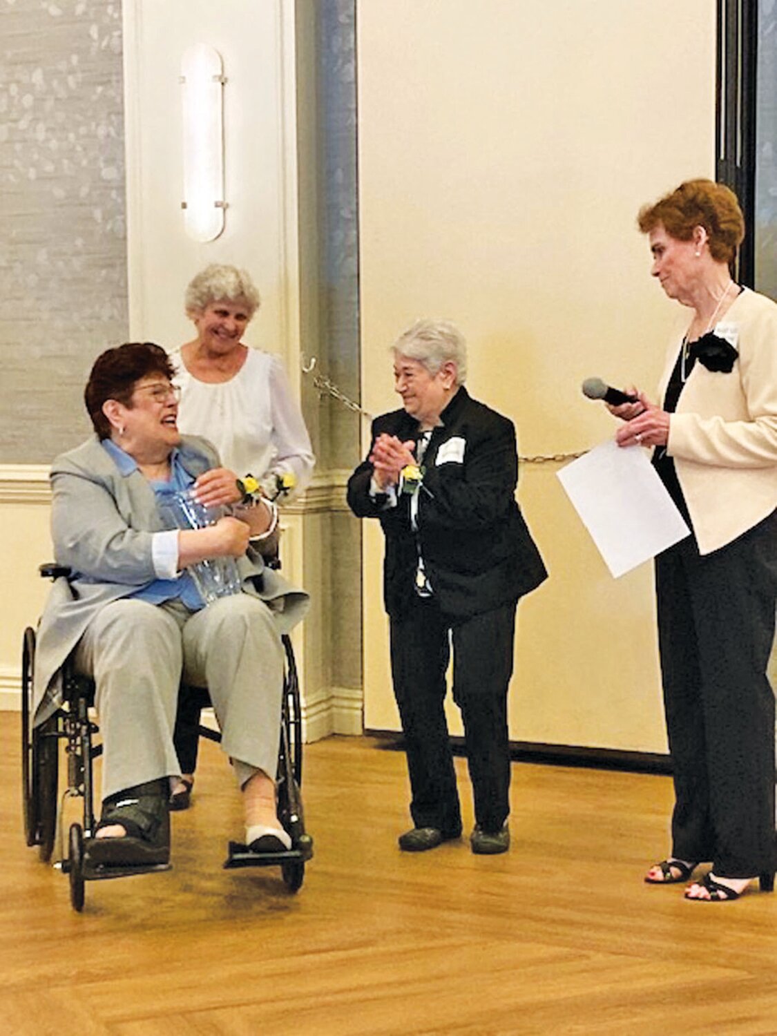 Deb Nerviano is presented with the 2023 Woman of the Year Award from the Ladies of Mount Carmel during the annual Communion Breakfast, held recently at the Bucks Club. With her are Carol Guckavan, Mona Kaminski and Mary Lou Gehring, former recipients of the award.