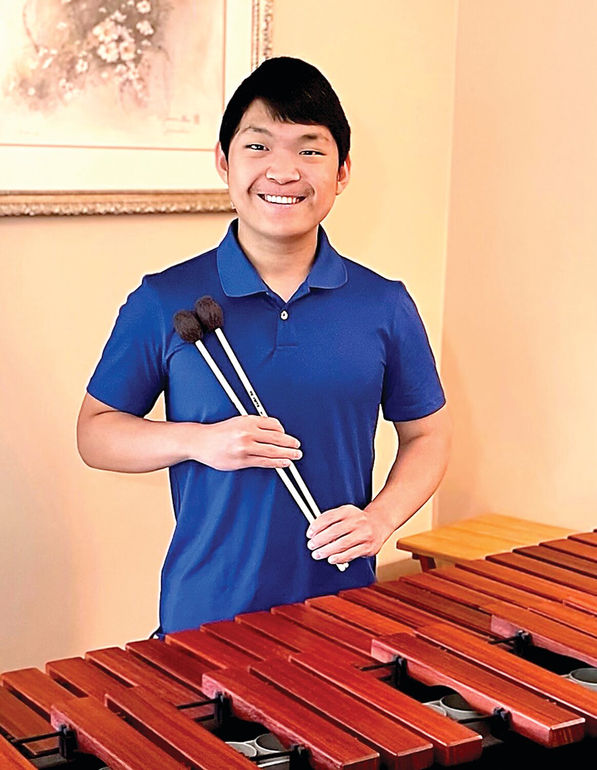 Mark Hintenlang Memorial Scholarship Award winner Will Thompson poses with his marimba.