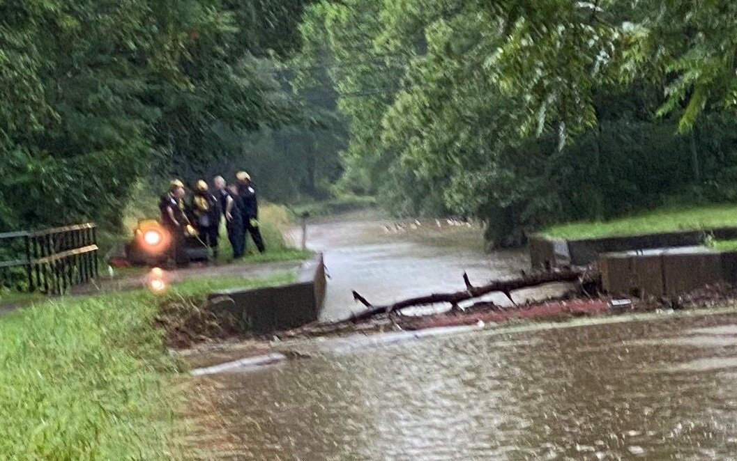 A rescue team works along the Delaware Canal Sunday morning during the search for those who went missing Saturday in a flash flood in Upper Makefield.