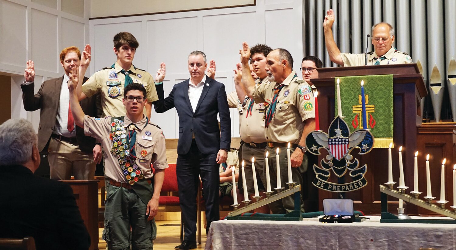 The Boy Scout salute is given at a ceremony on June 17.