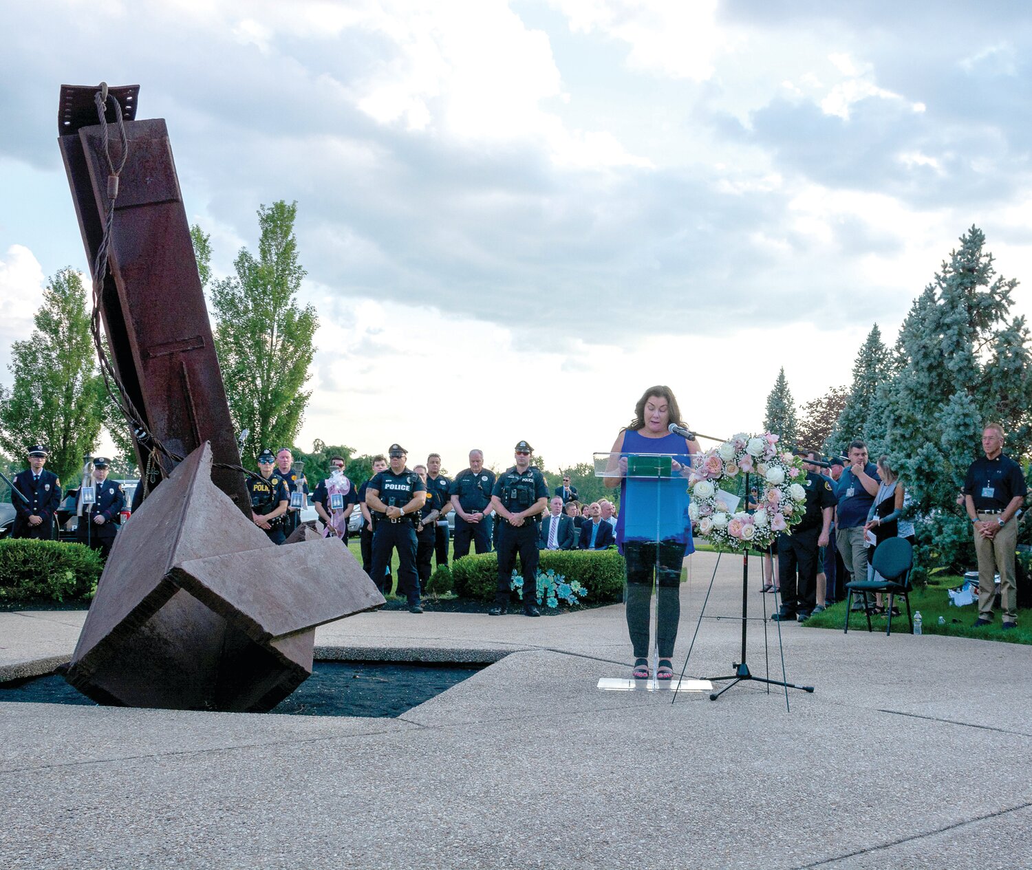 Ellen Saracini, chairman of 9-11 Memorial Garden of Reflection, speaks at the July 15 vigil for victims of the flash floods in Upper Makefield.
