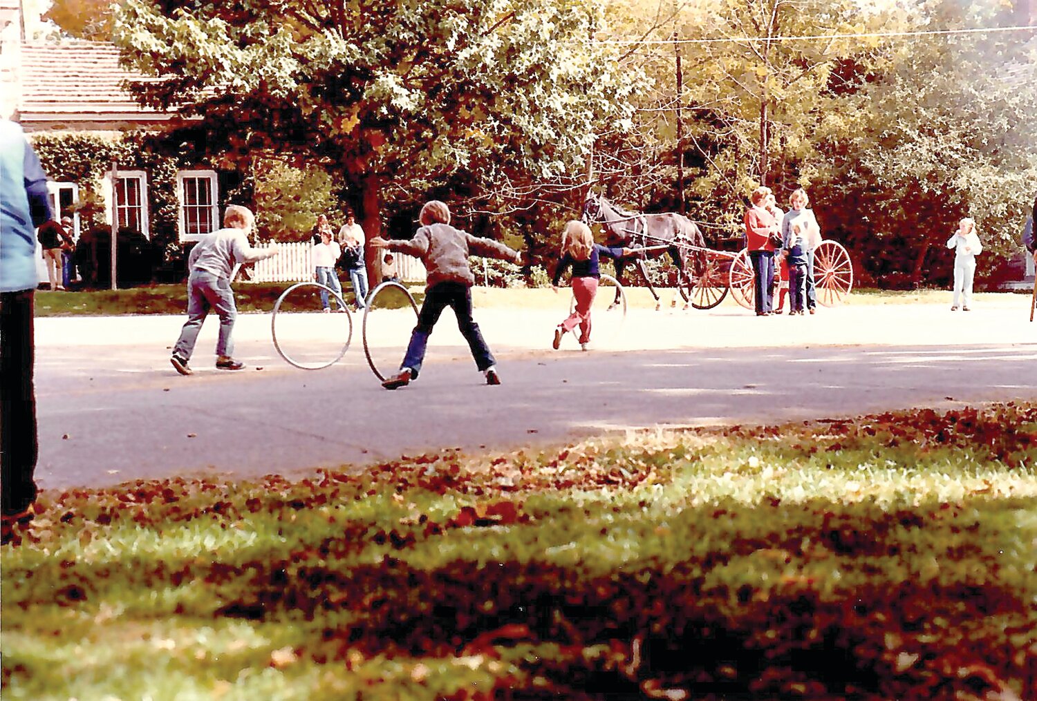 Children play in front of the Burges-Lippincott house during Historic Fallsington Day 1981.