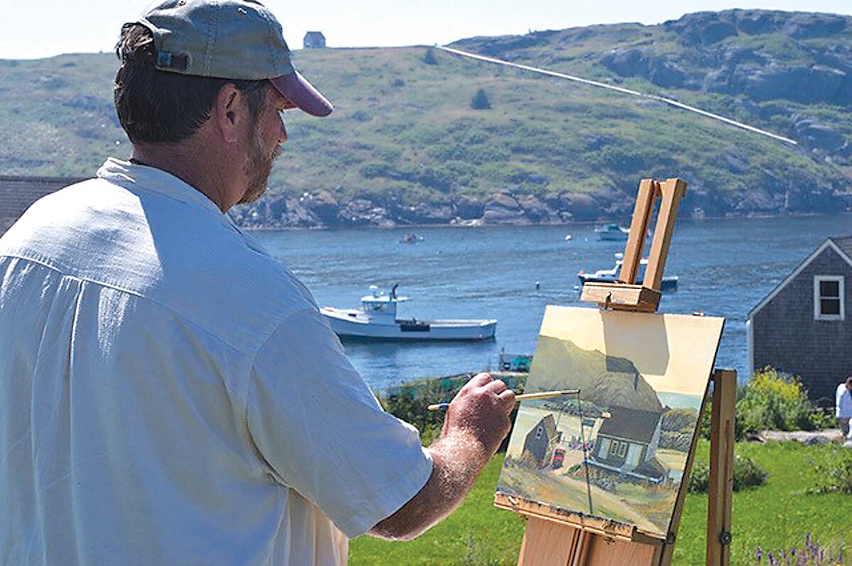 Jerry Cable works on one of his oil paintings from his spot on a hillside in Maine. Cable’s passion for historic buildings shows up often in his work.
