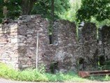 The ruins of the Heath Grist Mill mark the spot where Robert Heath constructed a grist mill on Sugan Road near York Road to process wheat and corn in or around 1707.
