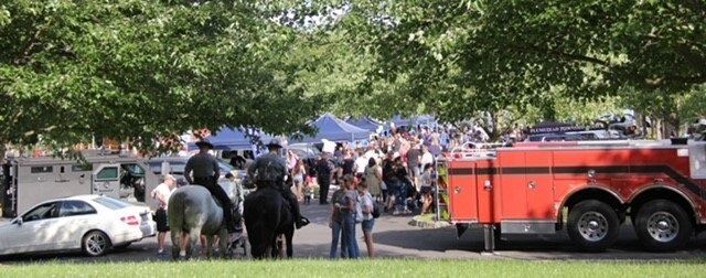 Mounted police officers watch events unfold at Tuesday’s National Night Out celebration in Doylestown Township.