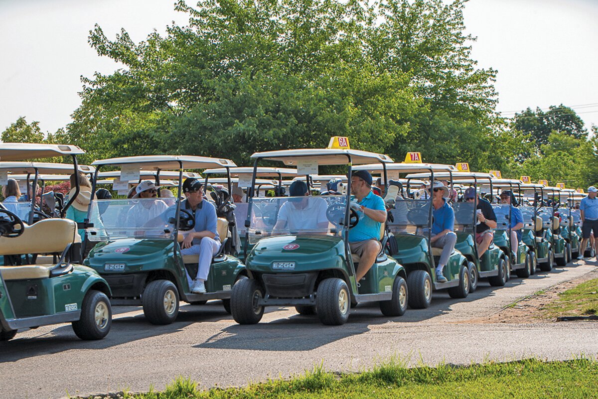 Golfers prepare to hit the links.