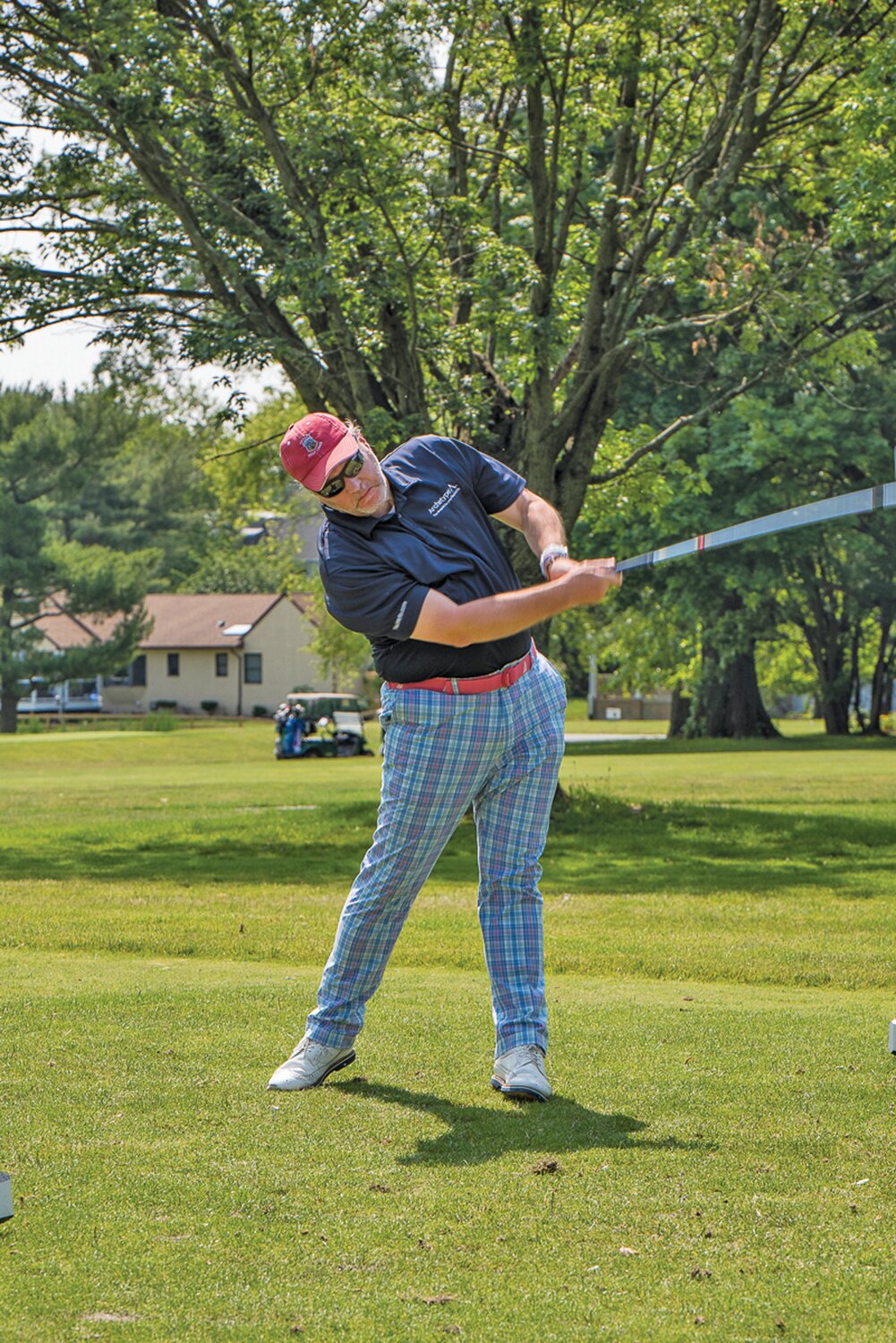 Bill Lahr, CEO of 2023 Title Sponsor Archetype Advisors, takes a swing during the Be Kind Golf Classic.