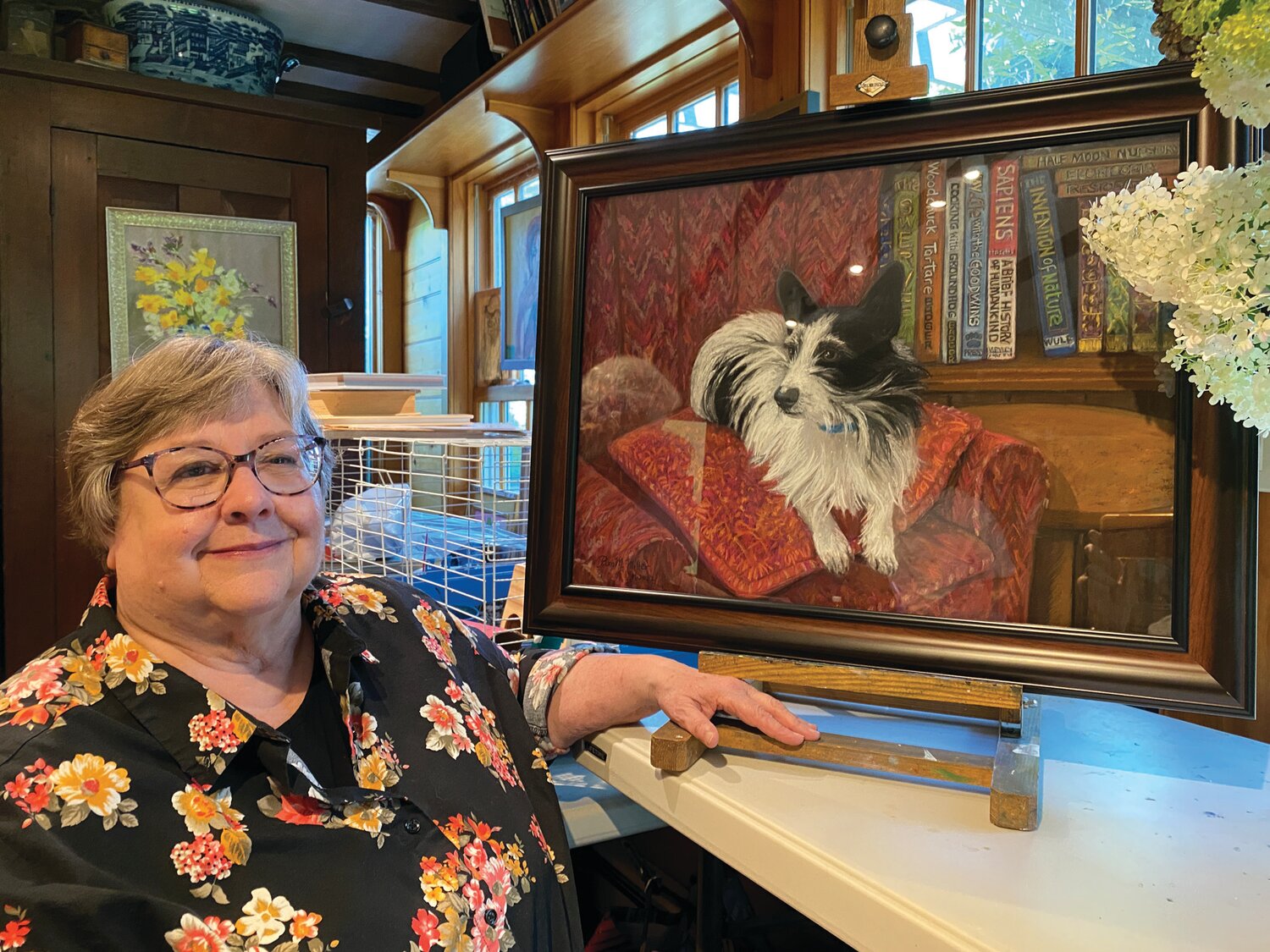 Pam Miller with her painting, “Badger: A Gentleman and a Scholar.”