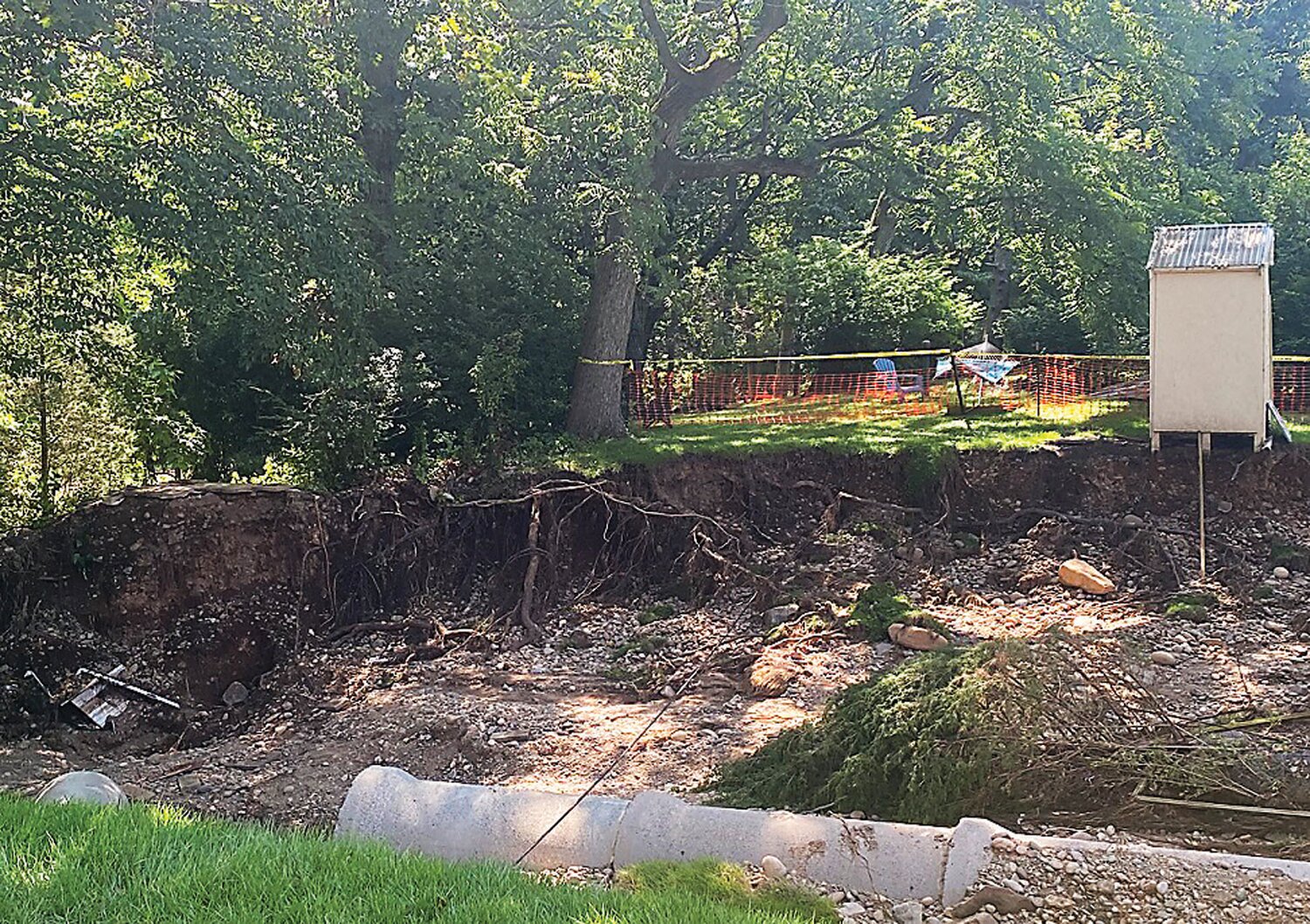 Damage inflicted in the Mapevale and Meadow Drive neighborhood by about six inches of rain that fell in two hours July 15 included a burst storm pipe that created a huge sinkhole.