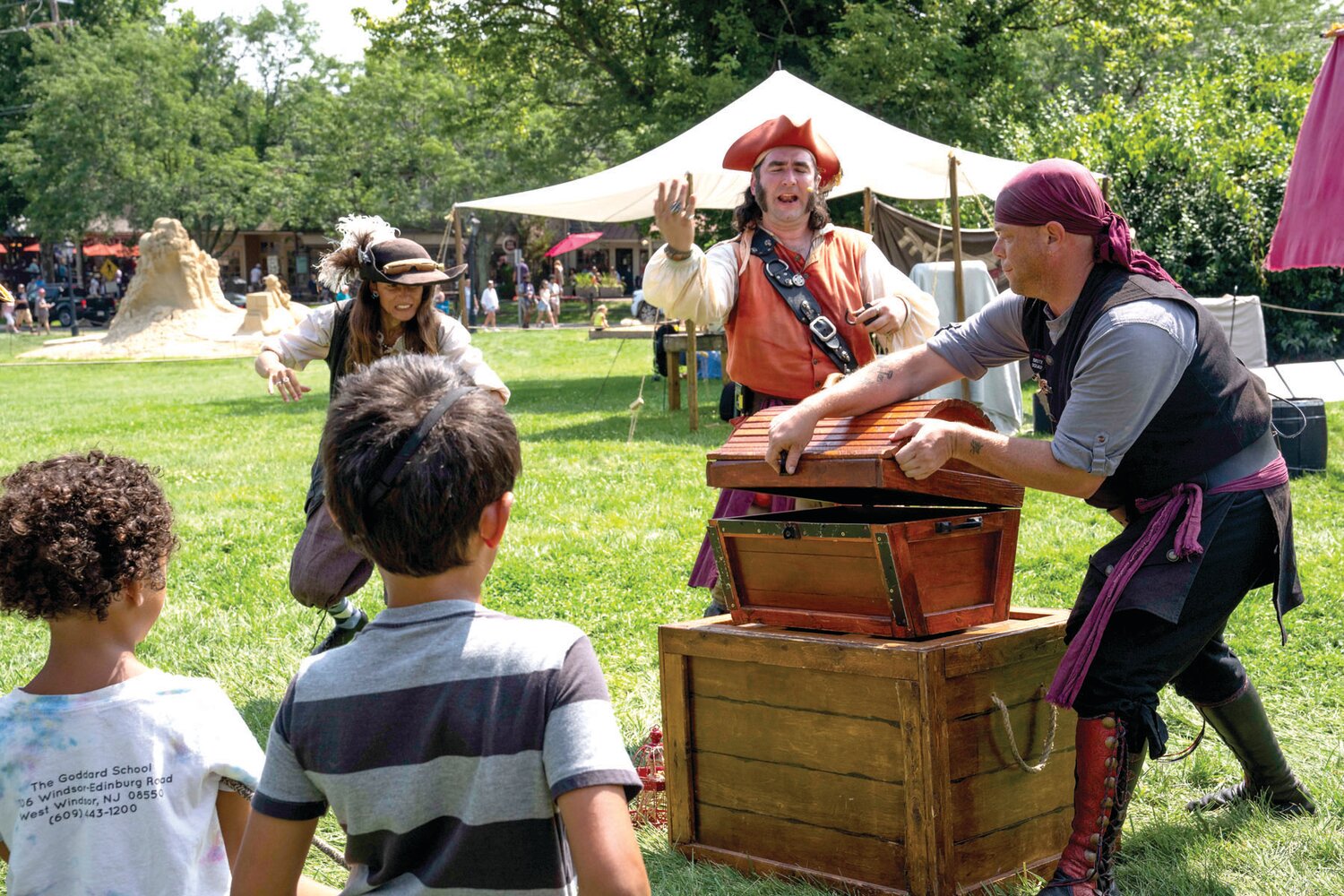 Members of Pirates of Fortune’s Folly, an entertainment group, lead fellow crewmates along for a treasure hunt at the Peddler's Village Peach Festival Aug. 6.