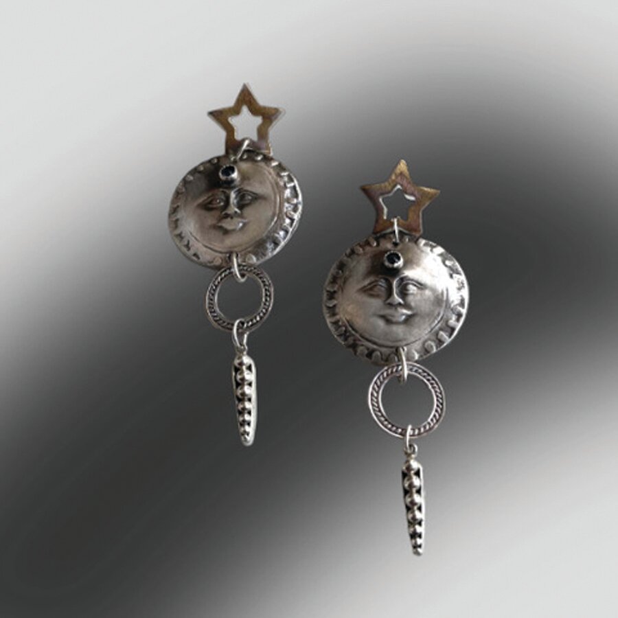 Silver earrings by Diana Contine of Dakota Moon.