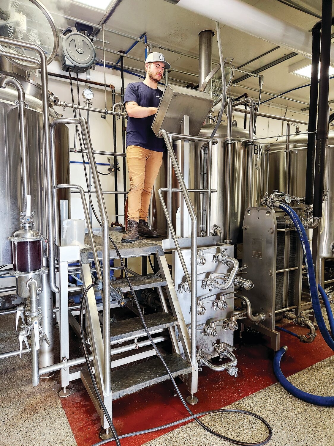 Matt Andersen, of Warwick Farm Brewing, starts the brewing process for the new Ale Trail ale.