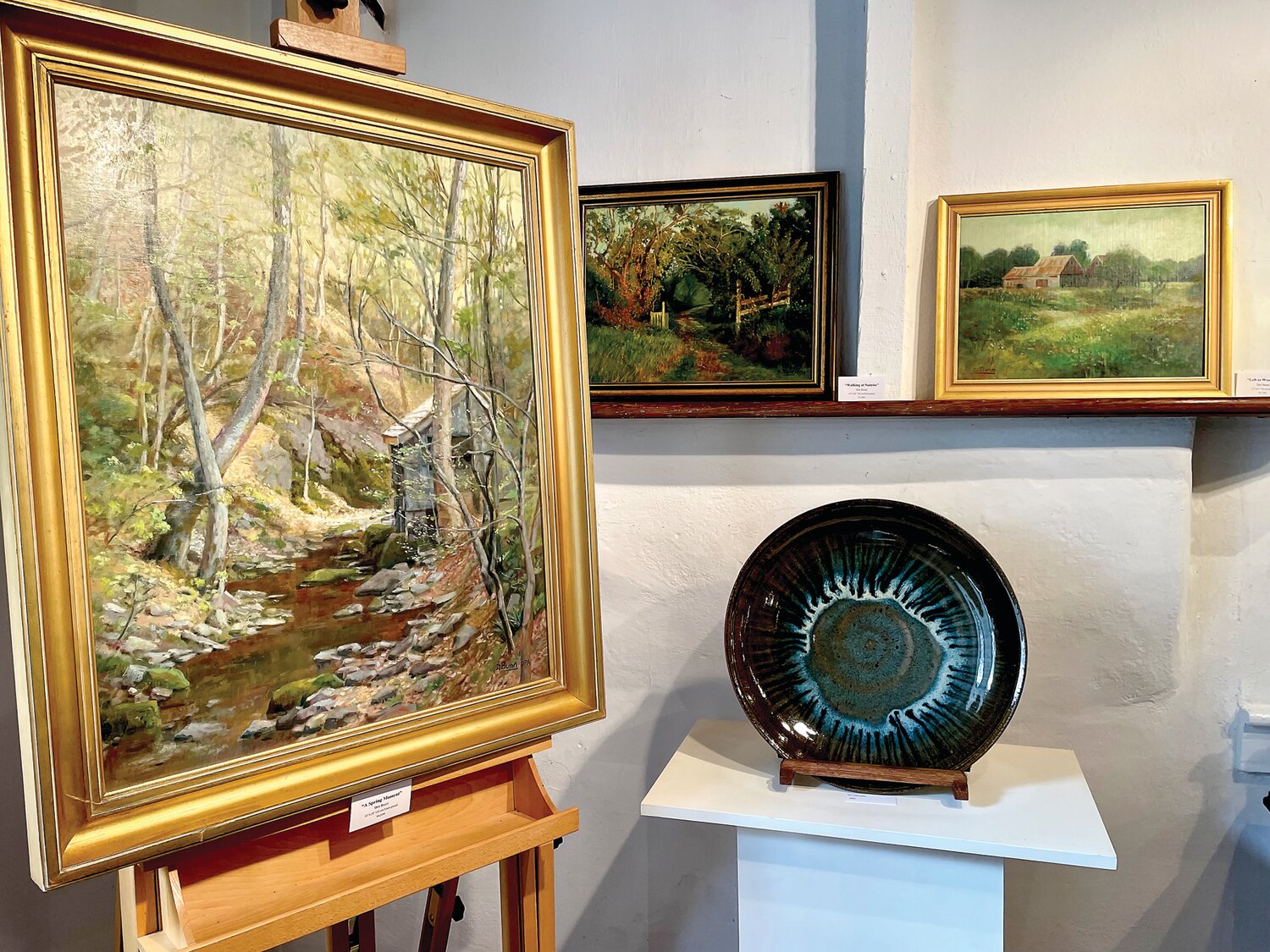 Paintings by Dot Bunn and stoneware by Willi Singleton.