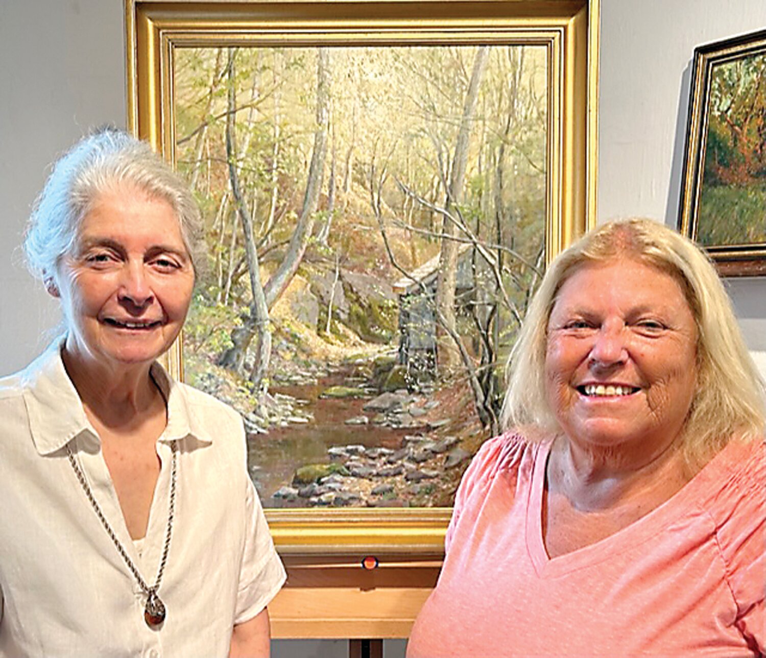 Dot Bunn, left, and Janet Soder with her new painting.