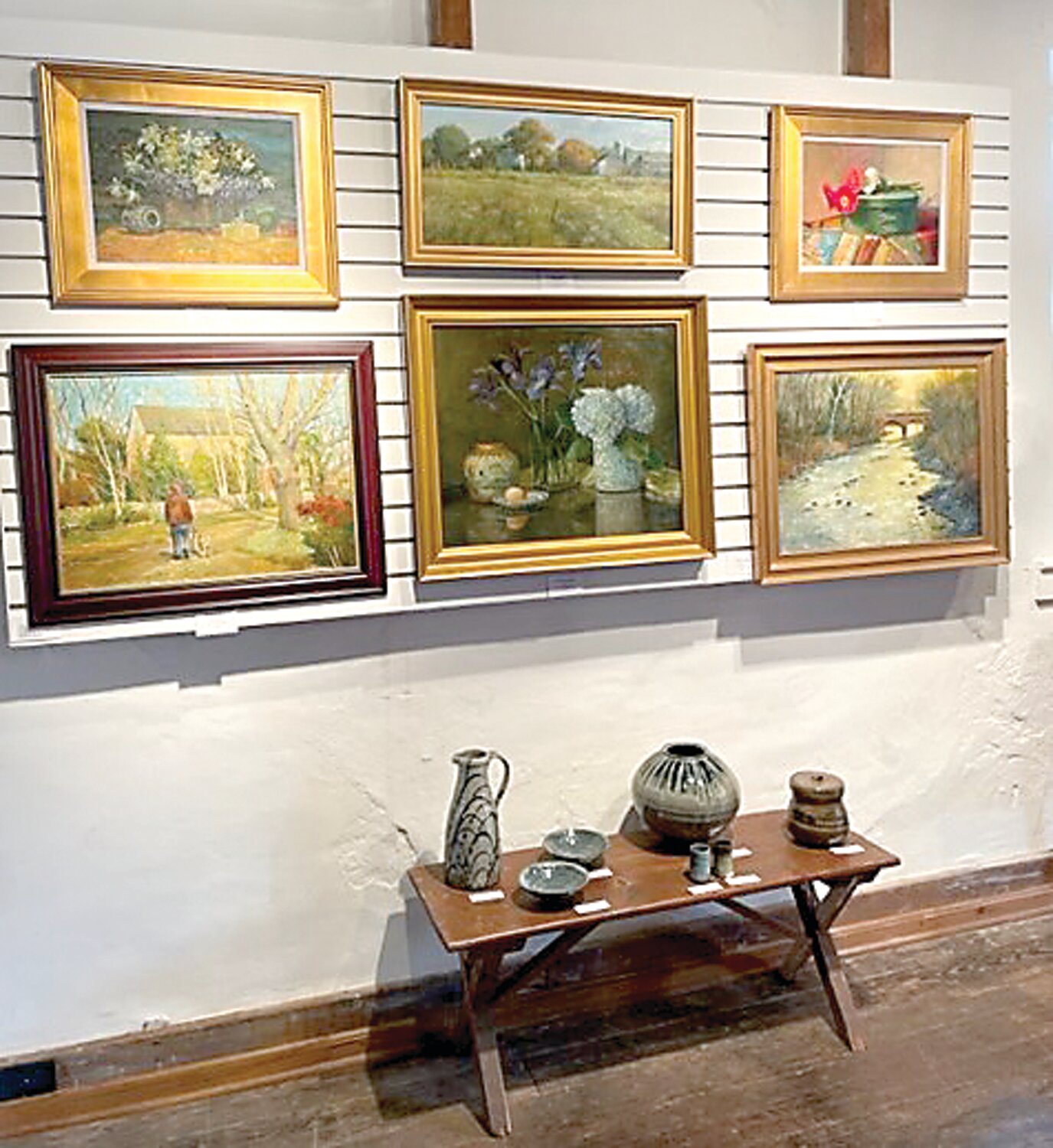 Paintings by Dot Bunn and stoneware by Willi Singleton.