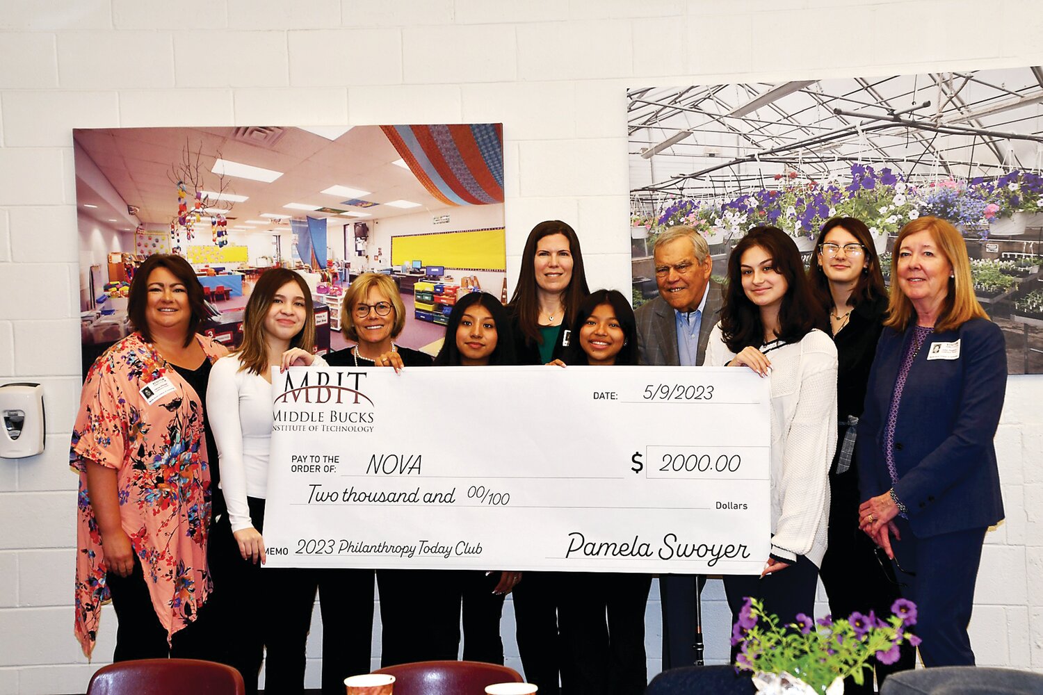 Members of the Philanthropy Today Club at Middle Bucks Institute of Technology joined representatives from The Norman Raab Foundation to present a check for $2,000 to NOVA. From left are: Jamie Pfister, training coordinator, NOVA; Carolina Balcarcel, Mariellen Brickley-Raab, Angie Patino, Sara Raab McInerny, Julissa Perez Ortiz, Stephen Raab, Emma Danilowicz, Katrina Puls; and Julie Dugery, coordinator of volunteers and community outreach, NOVA.