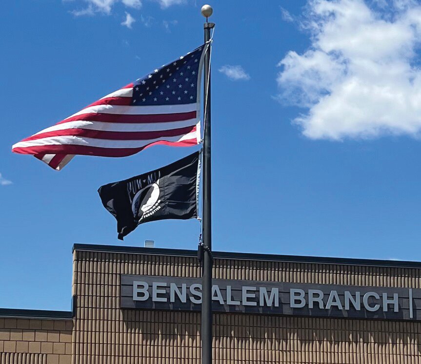 The Bensalem branch of the Bucks County Free Library flies the POW-MIA flag beneath Old Glory to call attention those who defended our nation and are still missing.