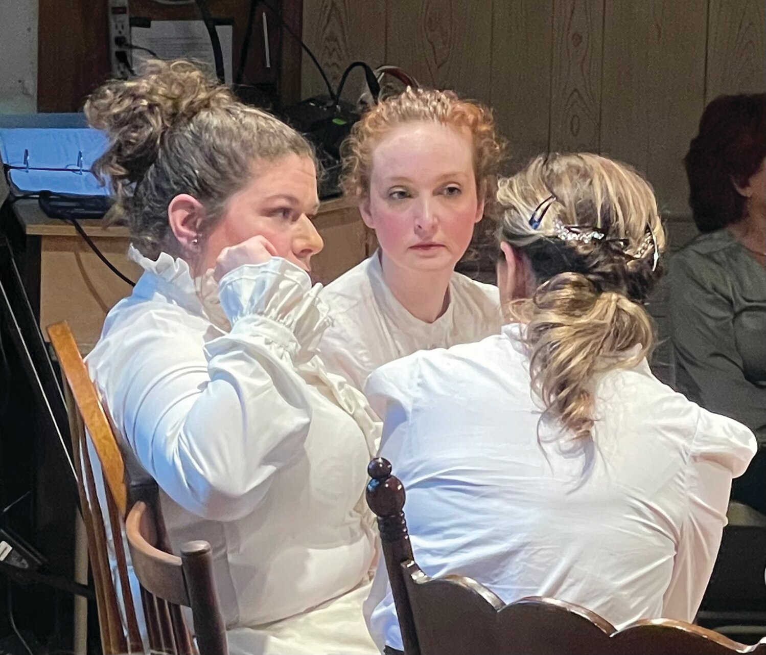 Concerned women of Doylestown, portrayed by Alex Lucy, Kim Cocconi, and Sally Donovan, discuss the dust choked streets in 1895.