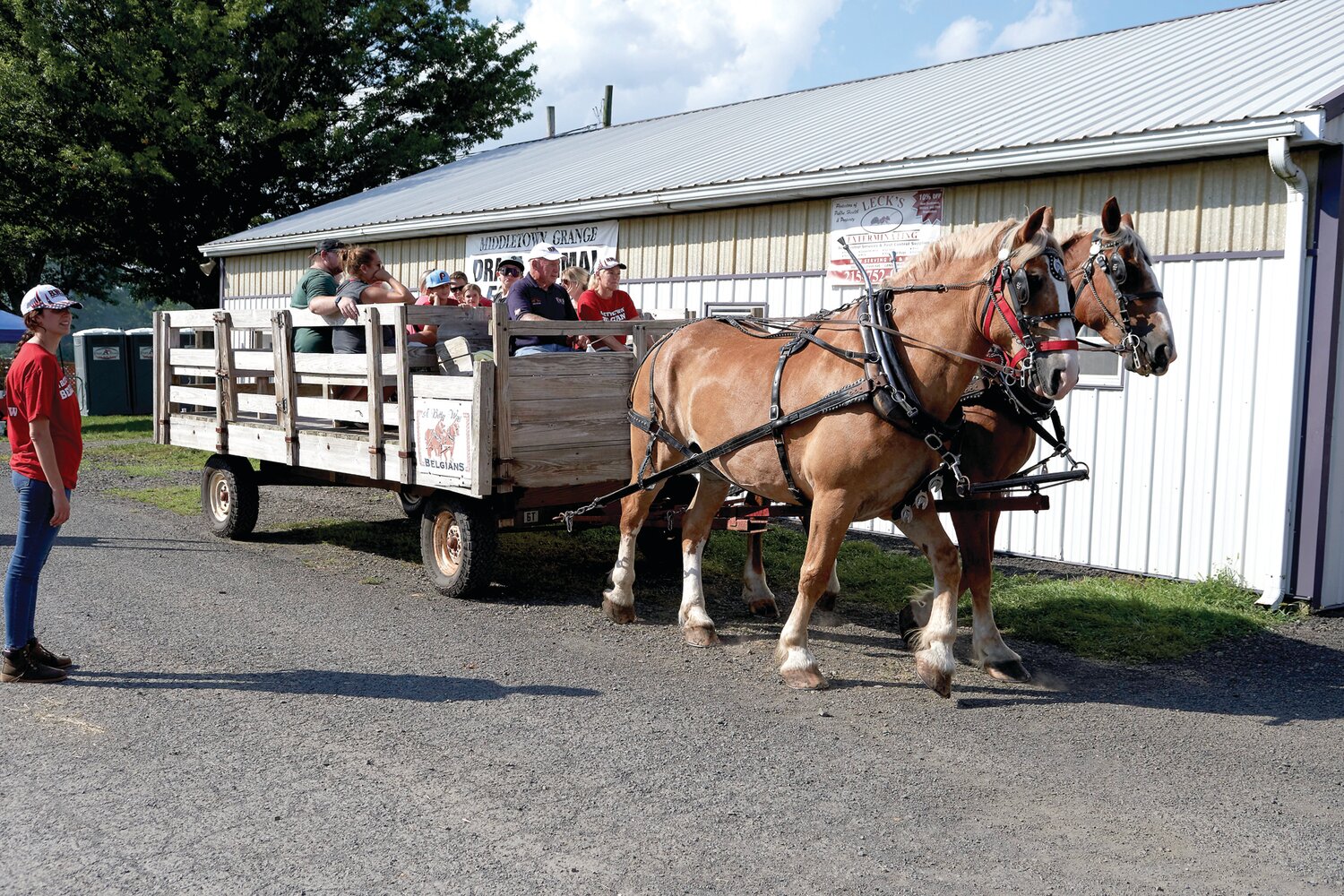 Middletown Grange Fair attendees ride a horse-drawn wagon Aug. 17.