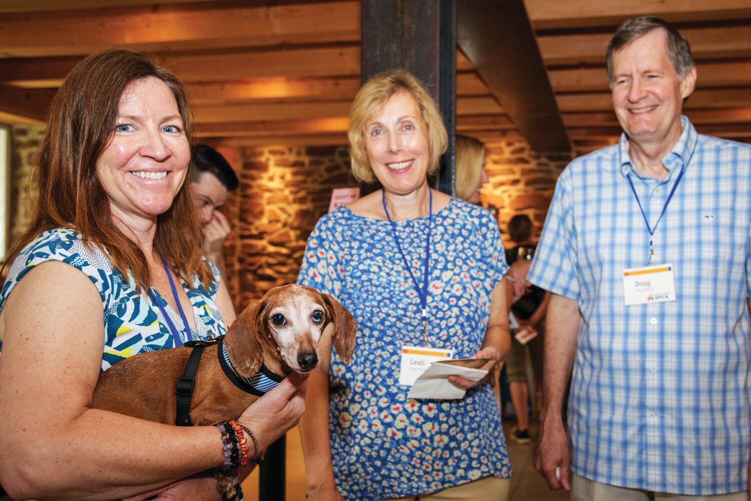 Eleasha Gall, Bucks County SPCA’s director of animal behavior, introduces Beanie the dog to Leah and Doug Beck.