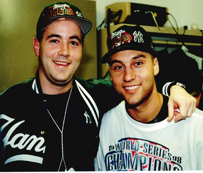 George Rose, left, poses for a photo with Yankees shortstop Derek Jeter after the team won the 1998 World Series. Rose, who lived in Yardley, died Sunday at the age of 57.