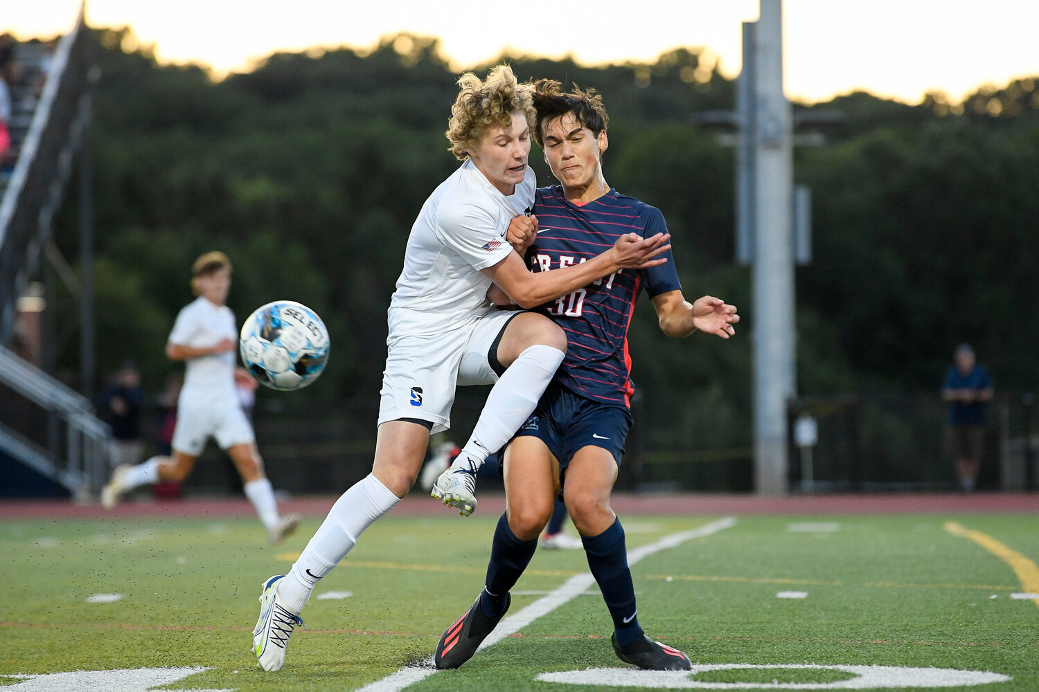 Central Bucks South’s Josh Dozier crashes into Central Bucks East’s Will Zlogar after clearing a pass.